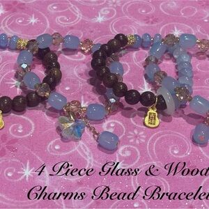 4 PC BRACELET SET OF BLUE & WOODEN BEADS WITH FLOWERS & GOLD MONEY BAGS CHARMS